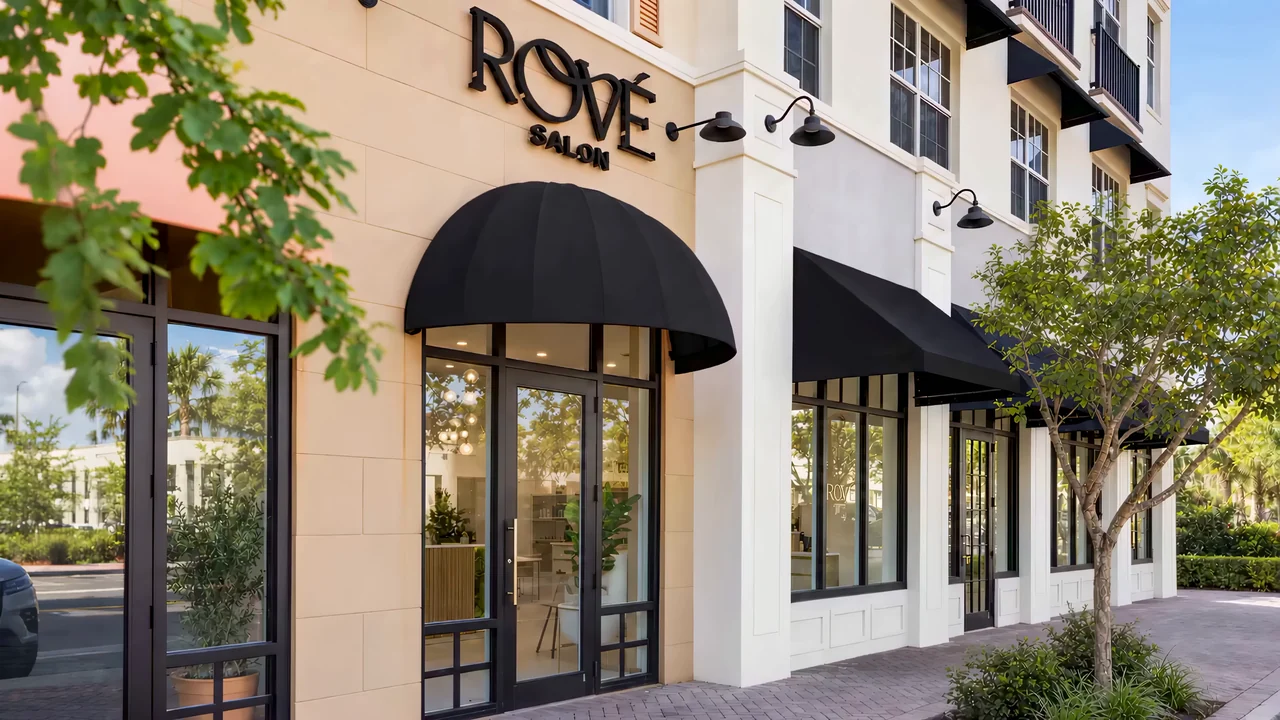 Rové’s entrance on NE 2nd Avenue in daylight, framed by trees and black awnings
