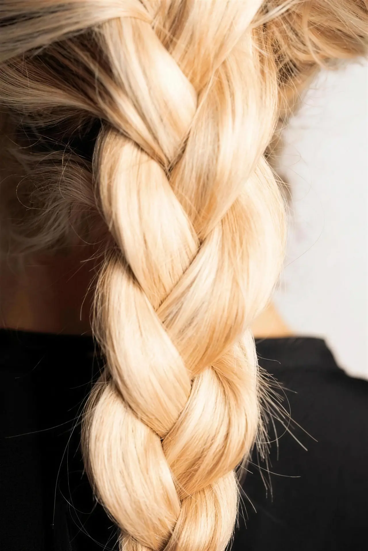 A loose blonde braid with softly woven texture