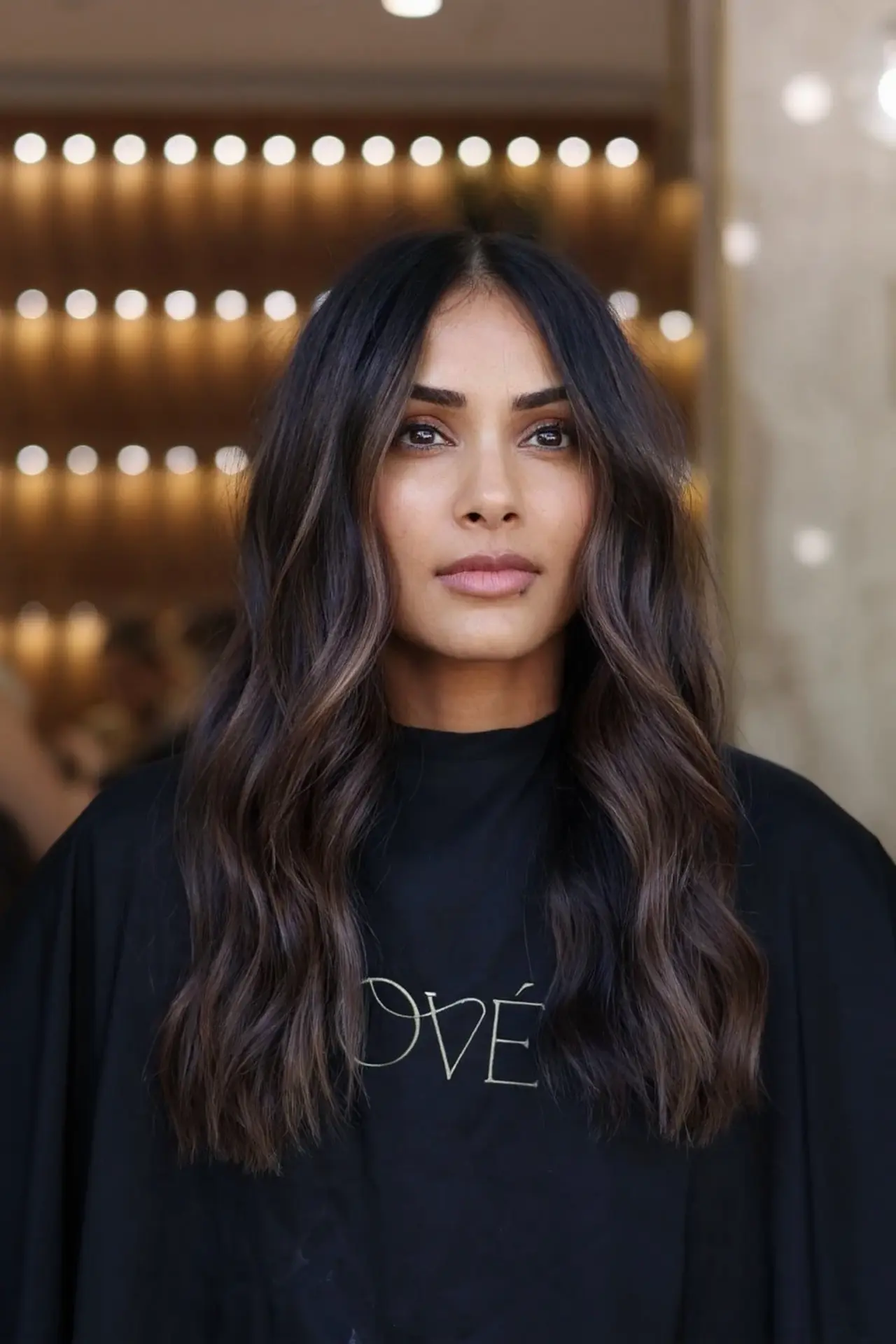 Long dark brunette waves with subtle warm dimension, photographed from the front at Rové