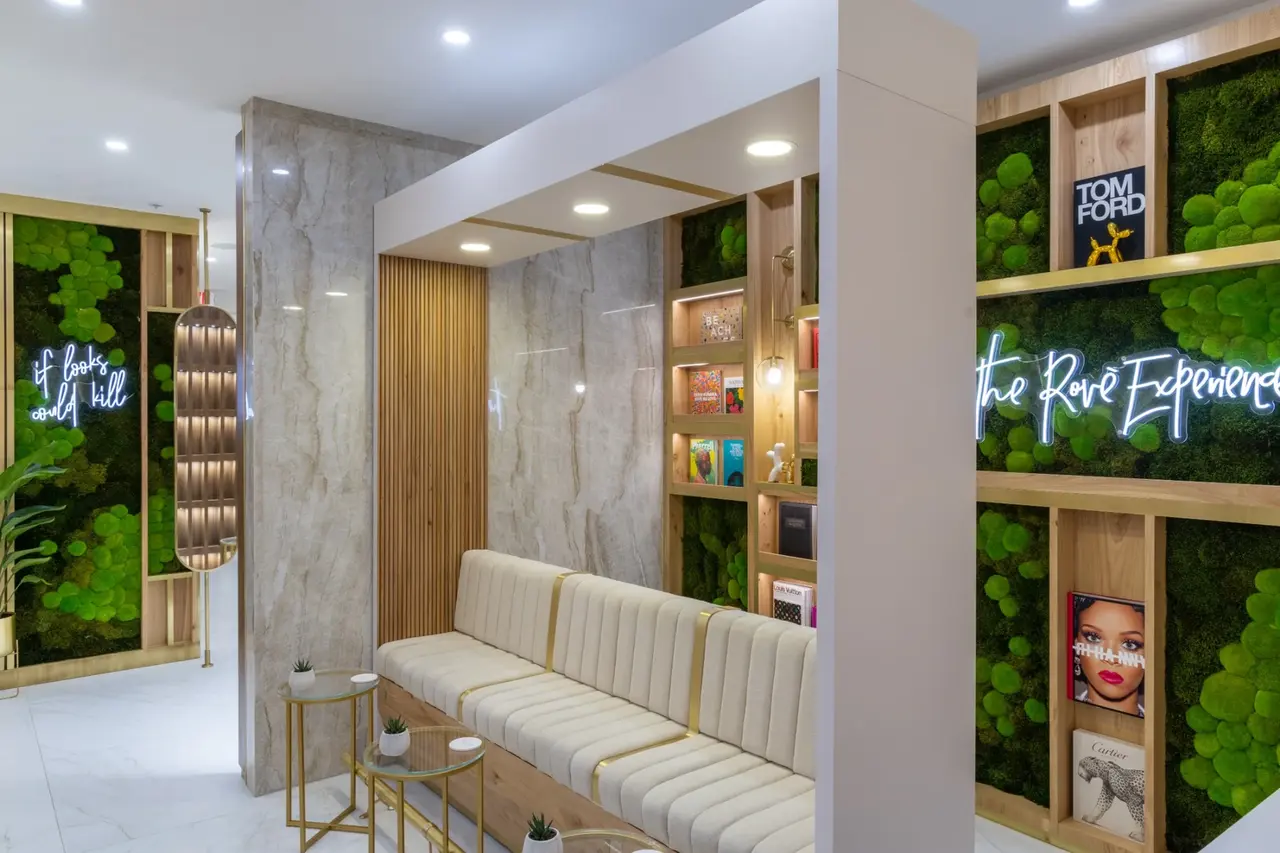 Warm oak, soft seating and greenery inside Rové