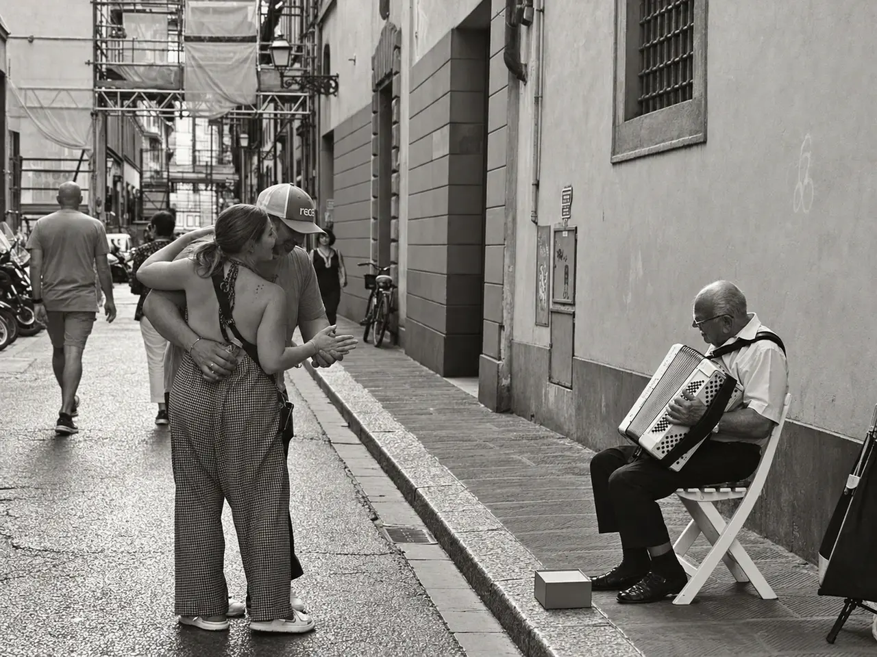 Jodi dancing beside a street musician
